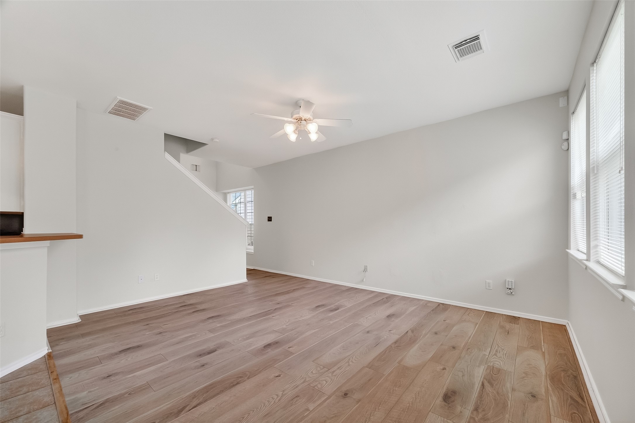 16623 Newglen Lane Houston, TX 77084 - Photo 13 of 33 wooden floor in an empty room with a window