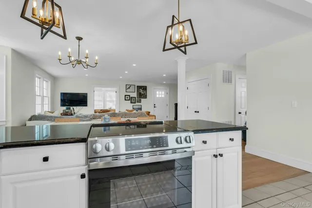 a view of a backyard with plants and large trees
