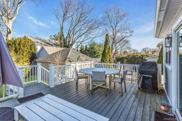 a bathroom with a granite countertop sink mirror vanity and toilet