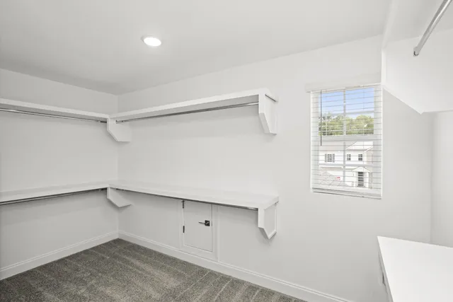 a view of a room that has a window in it