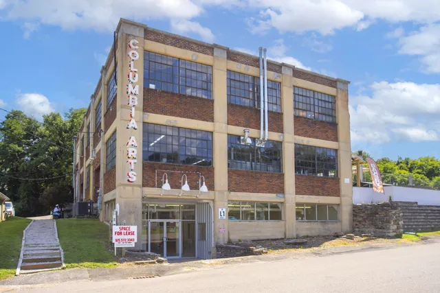 a front view of a building and a yard