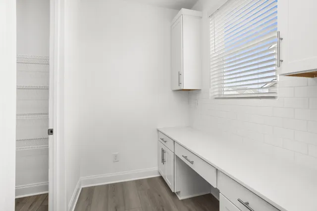 a room with cabinets and a window