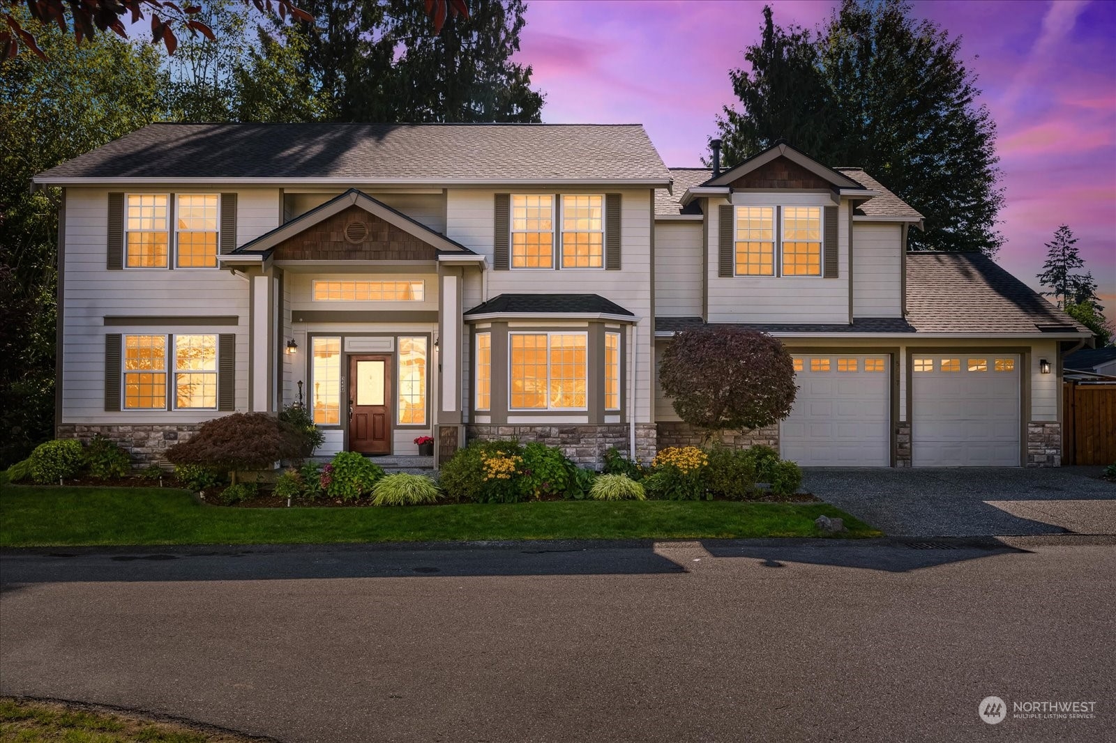 5407 Northeast 3rd Place Renton, WA 98059 - Photo 1 of 39 a front view of a house with garden