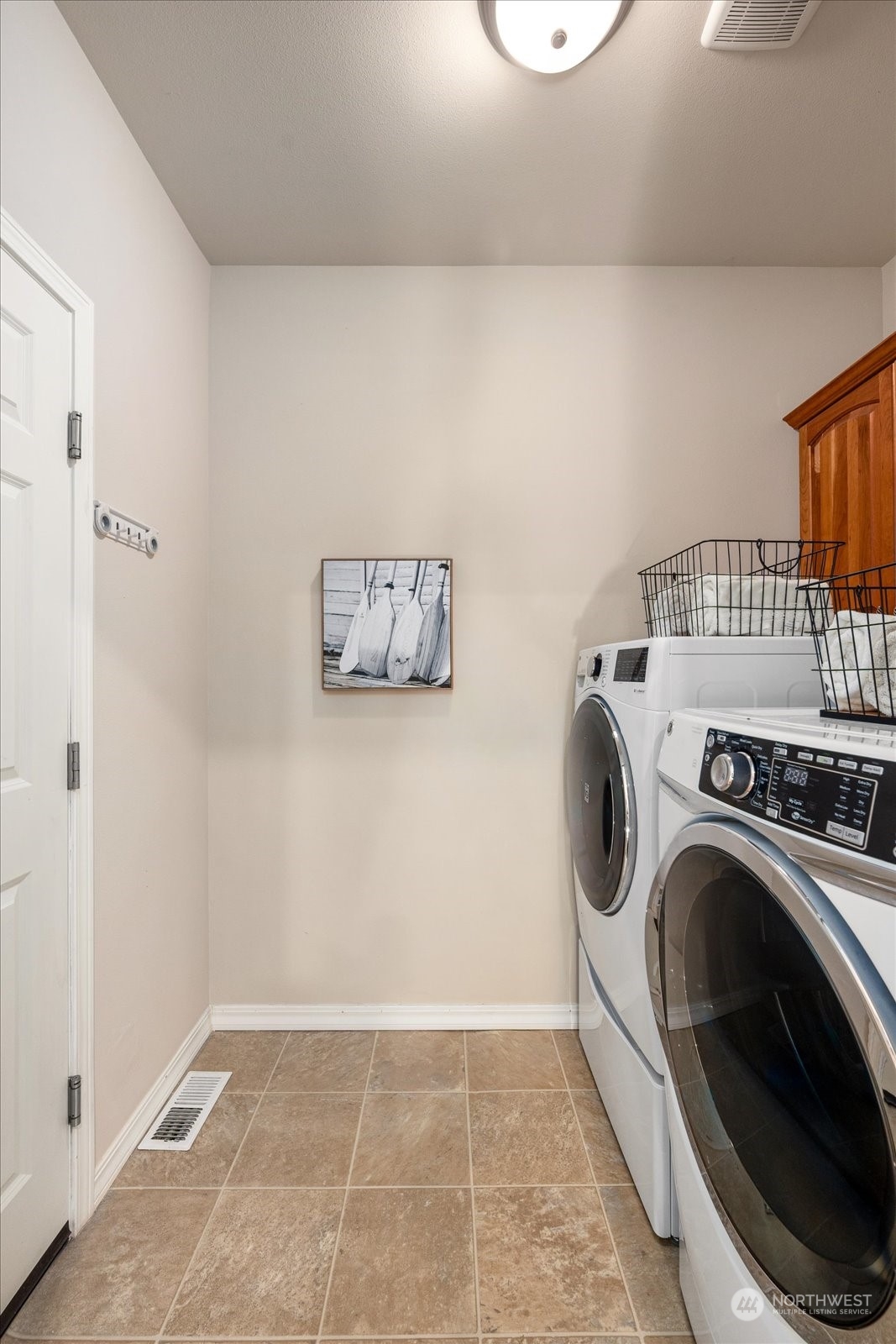 5407 Northeast 3rd Place Renton, WA 98059 - Photo 17 of 39 a view of a storage & utility room with washer and dryer