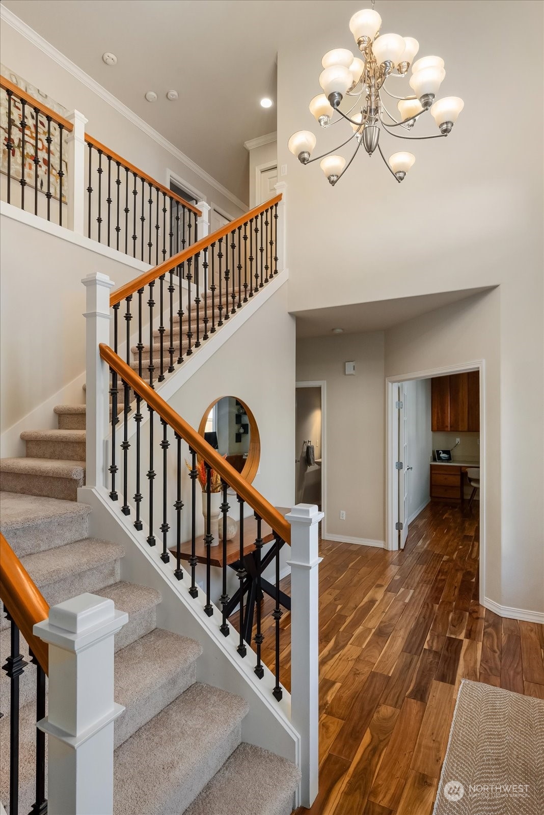 5407 Northeast 3rd Place Renton, WA 98059 - Photo 18 of 39 a view of an entryway wooden floor and a chandelier