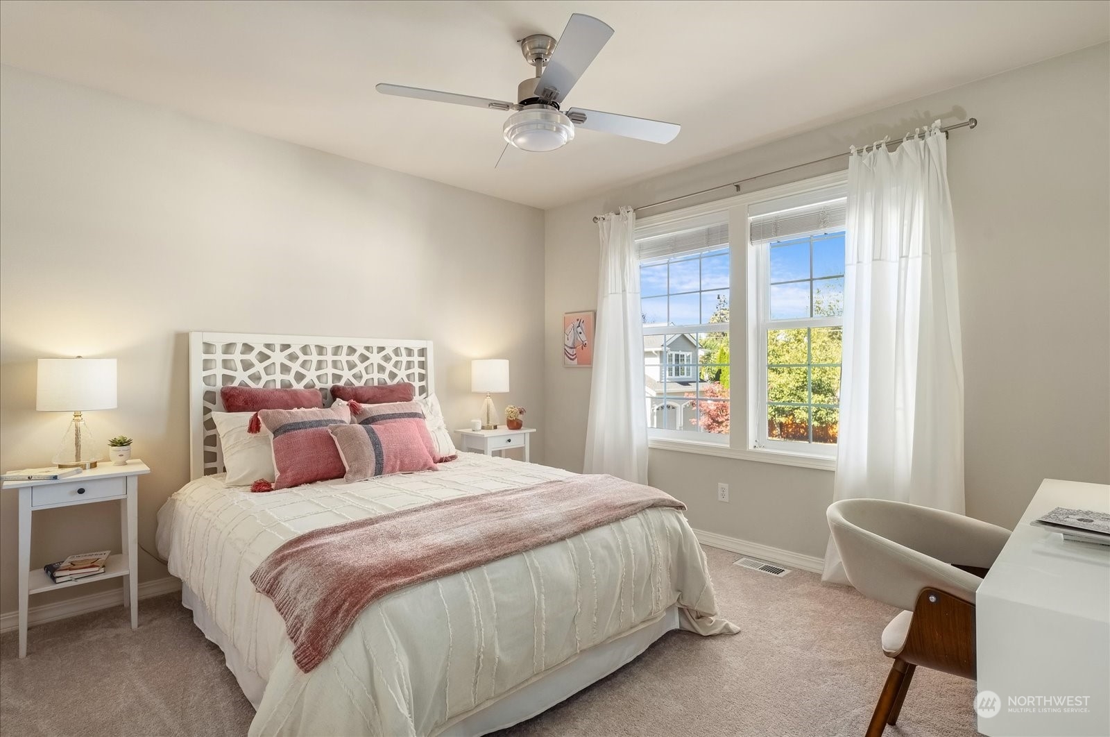 5407 Northeast 3rd Place Renton, WA 98059 - Photo 24 of 39 a bedroom with a bed and a chair