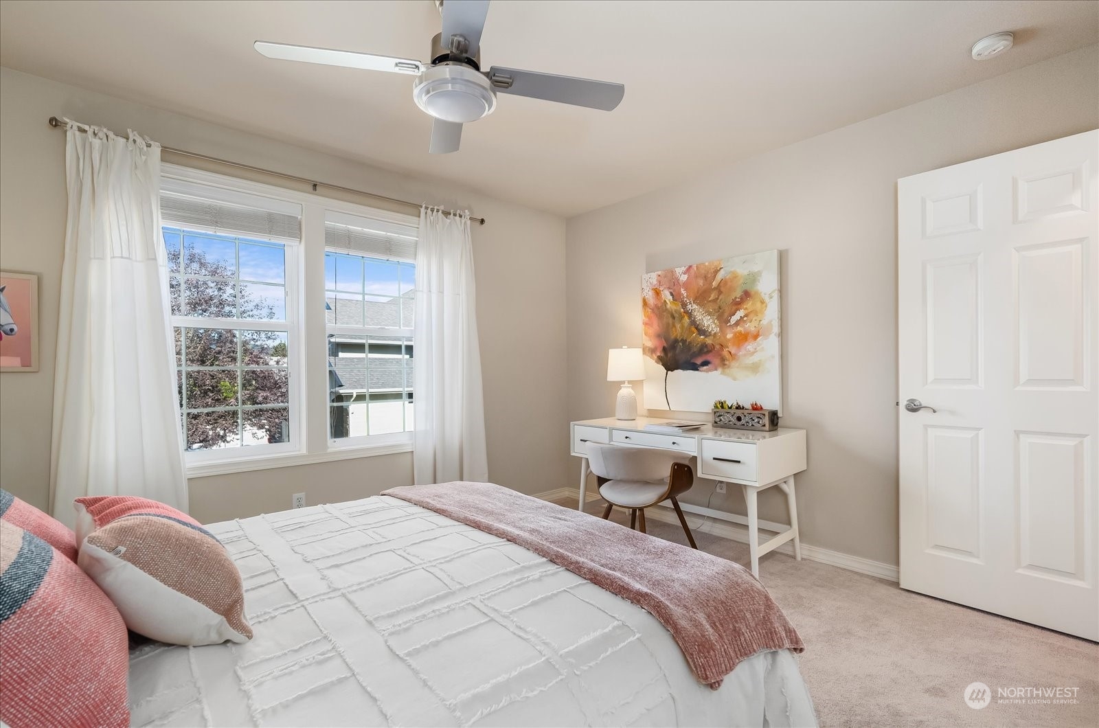 5407 Northeast 3rd Place Renton, WA 98059 - Photo 25 of 39 a bedroom with a bed and a window