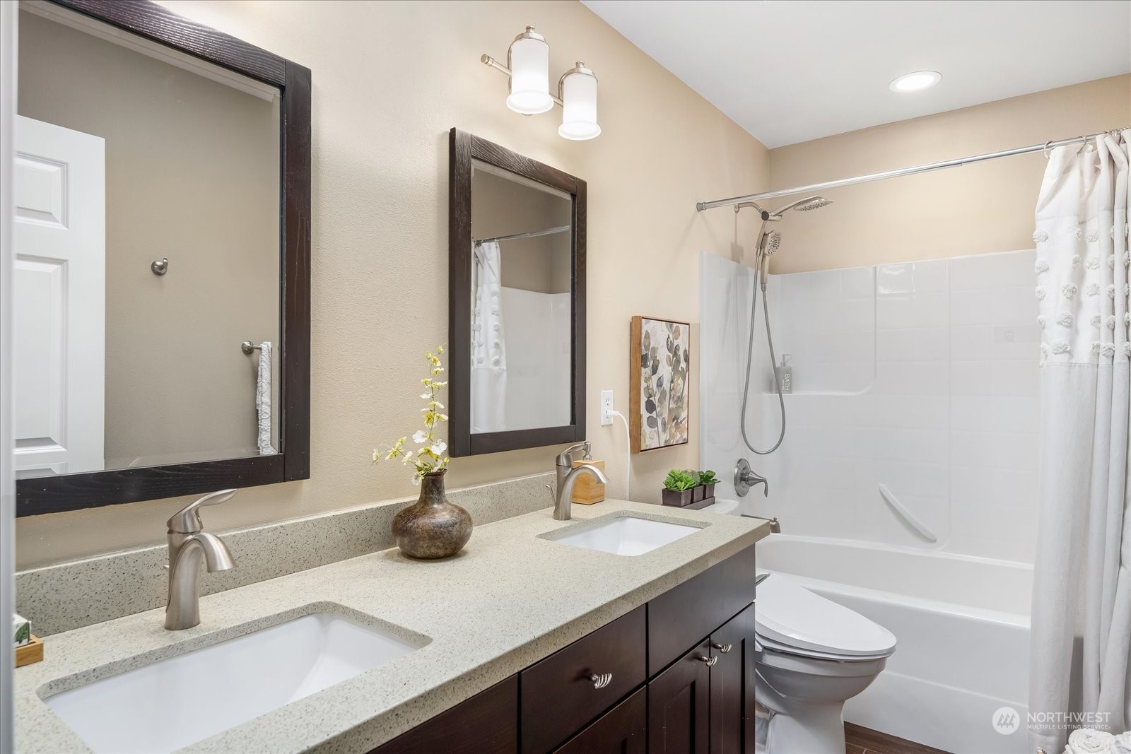 5407 Northeast 3rd Place Renton, WA 98059 - Photo 28 of 39 a bathroom with a double vanity sink toilet mirror and shower