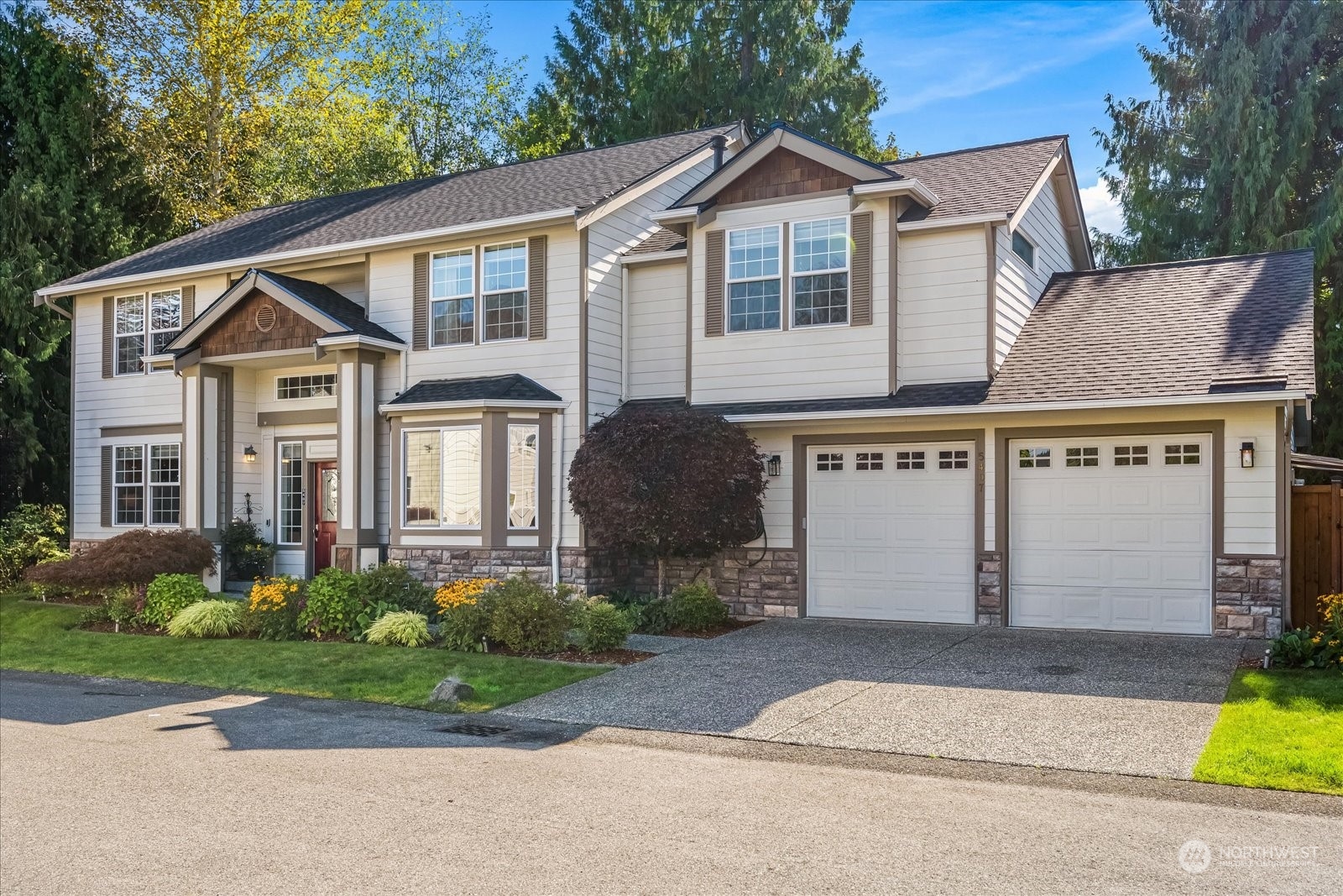 5407 Northeast 3rd Place Renton, WA 98059 - Photo 39 of 39 a front view of a house with a garden and plants