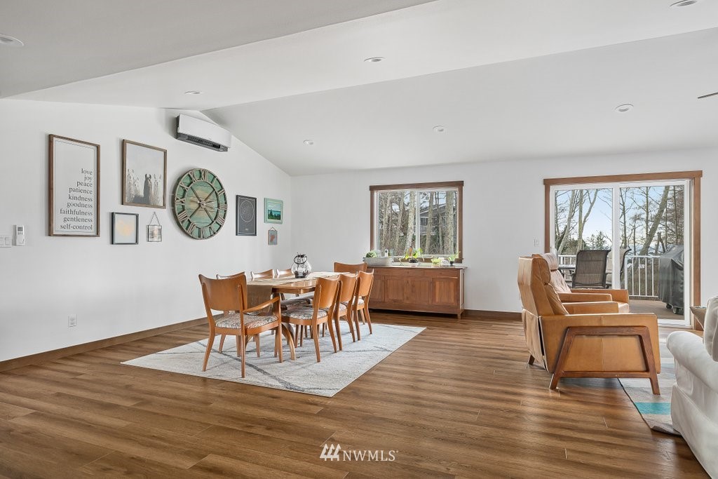1471 North View Road Oak Harbor, WA 98277 - Photo 12 of 38 a view of a dining room with furniture a rug and wooden floor