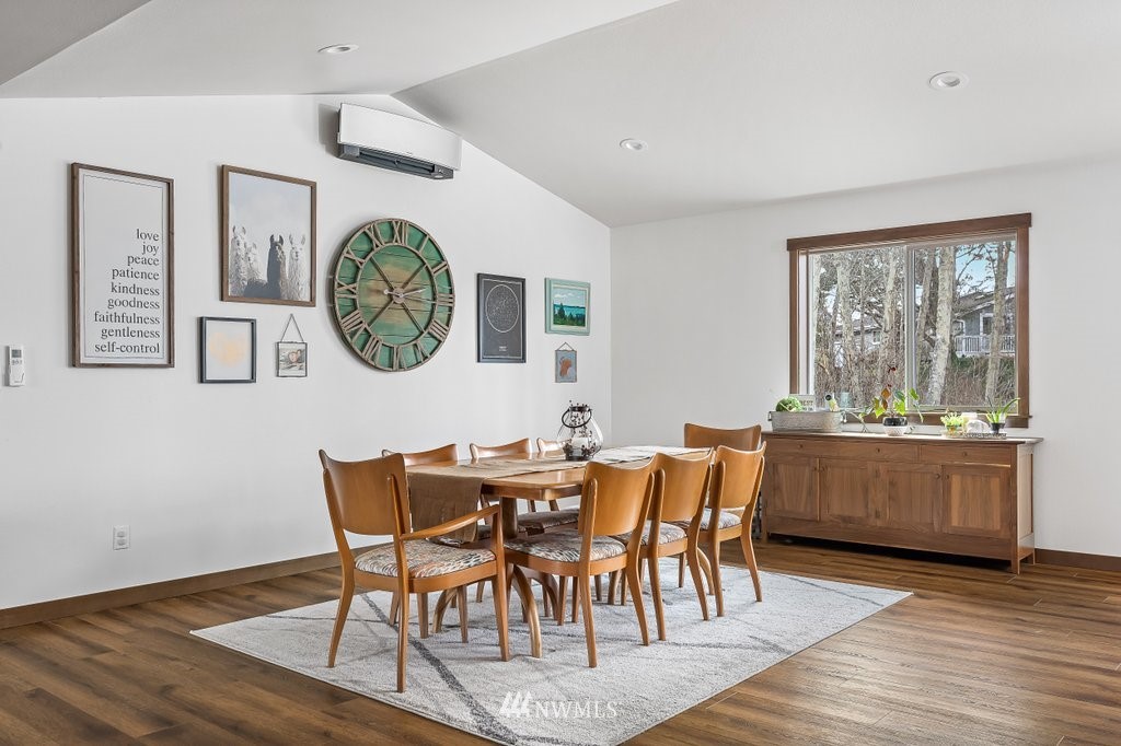1471 North View Road Oak Harbor, WA 98277 - Photo 15 of 38 a view of a dining room with furniture and wooden floor