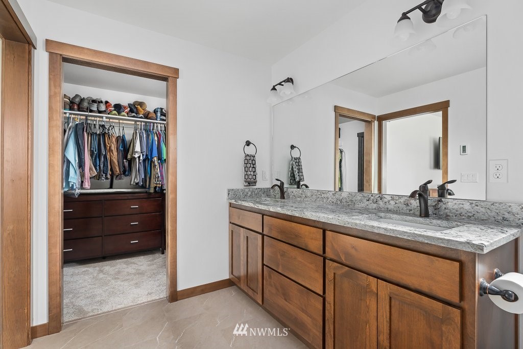 1471 North View Road Oak Harbor, WA 98277 - Photo 21 of 38 a bathroom with a sink a vanity and mirror