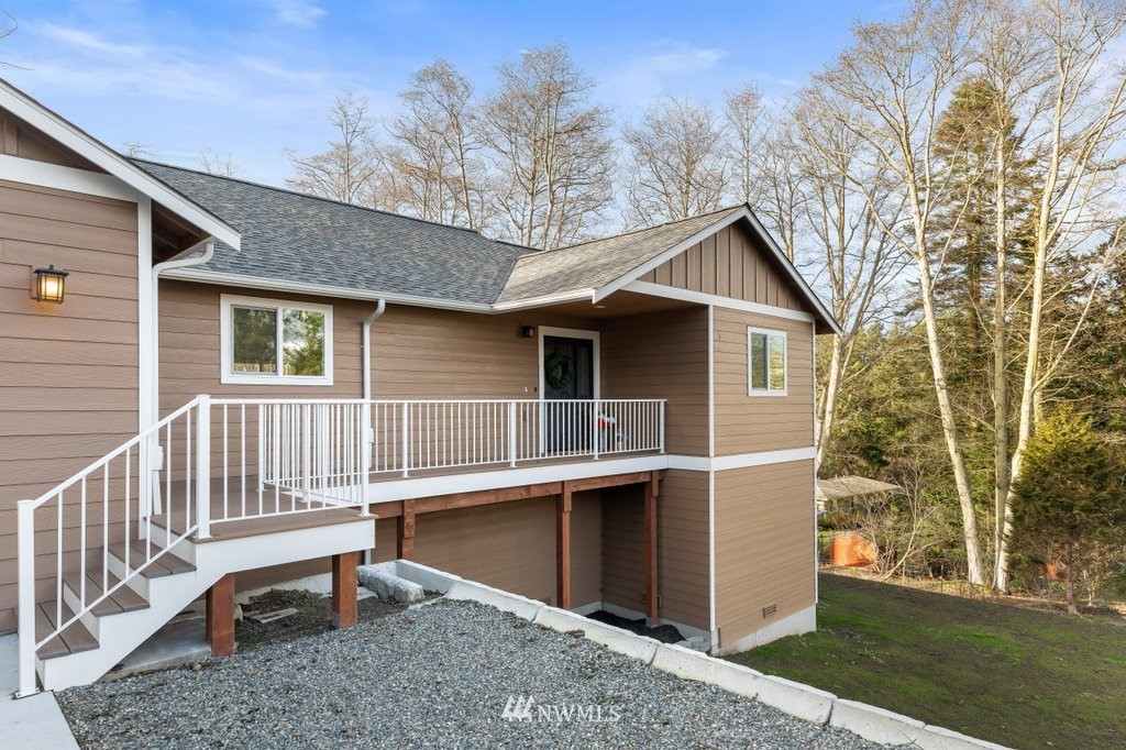 1471 North View Road Oak Harbor, WA 98277 - Photo 37 of 38 a view of backyard of house with deck and outdoor seating