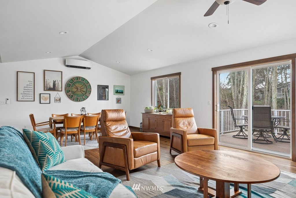 1471 North View Road Oak Harbor, WA 98277 - Photo 10 of 38 a living room with furniture a table and a large window