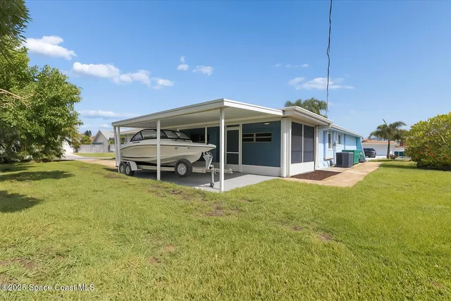 a view of a dining room with furniture and a potted plant
