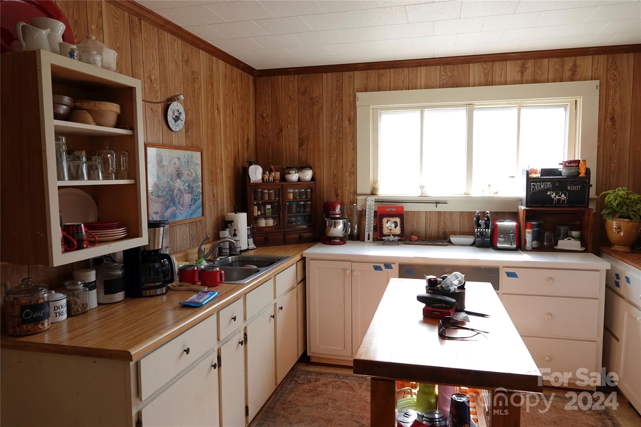 1276 Golf Course Road Tryon, NC 28782 - Photo 18 of 28 a kitchen with a sink cabinets and a window