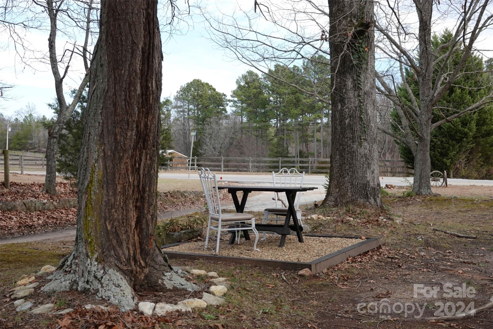 1276 Golf Course Road Tryon, NC 28782 - Photo 6 of 28 a view of a backyard with sitting area