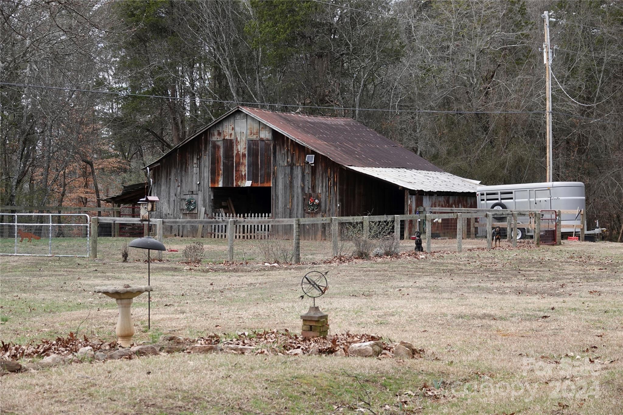 1276 Golf Course Road Tryon, NC 28782 - Photo 8 of 28 a backyard of a house with shaded area