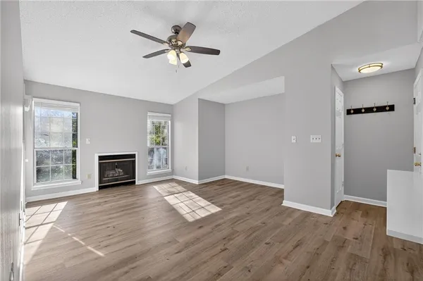 a view of livingroom with hardwood floor and a ceiling fan