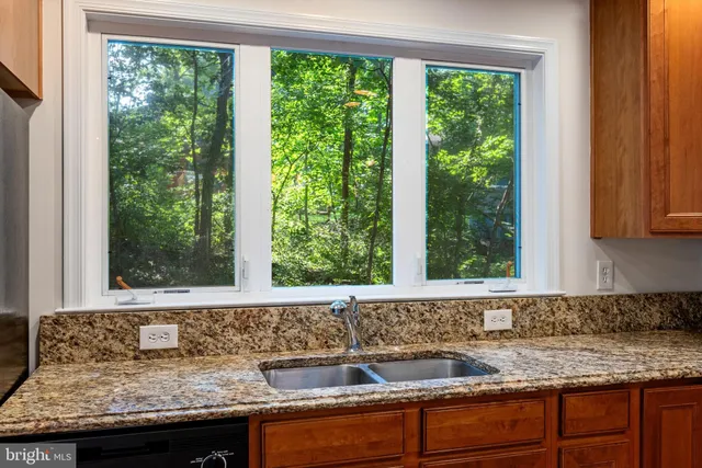 a view of a sink and a window