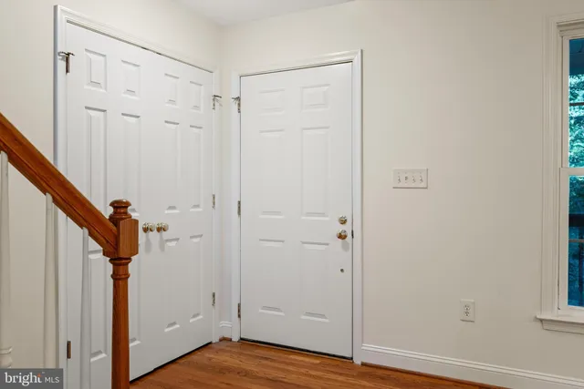 a view of an entryway with wooden floor
