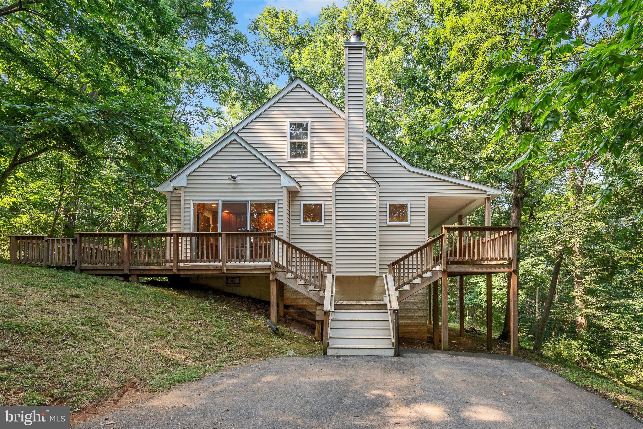 175 Easy Hollow Road Front Royal, VA 22630 - Photo 2 of 42 a view of a house with a yard and sitting area