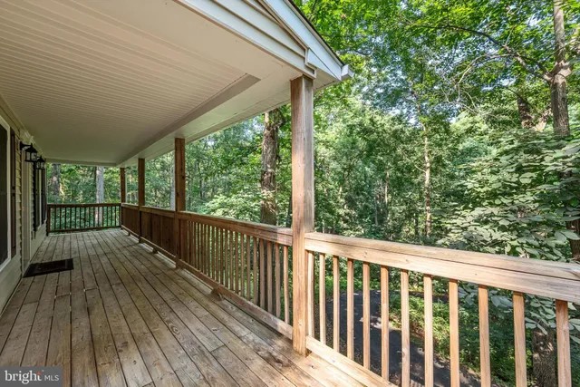 a view of balcony with wooden floor
