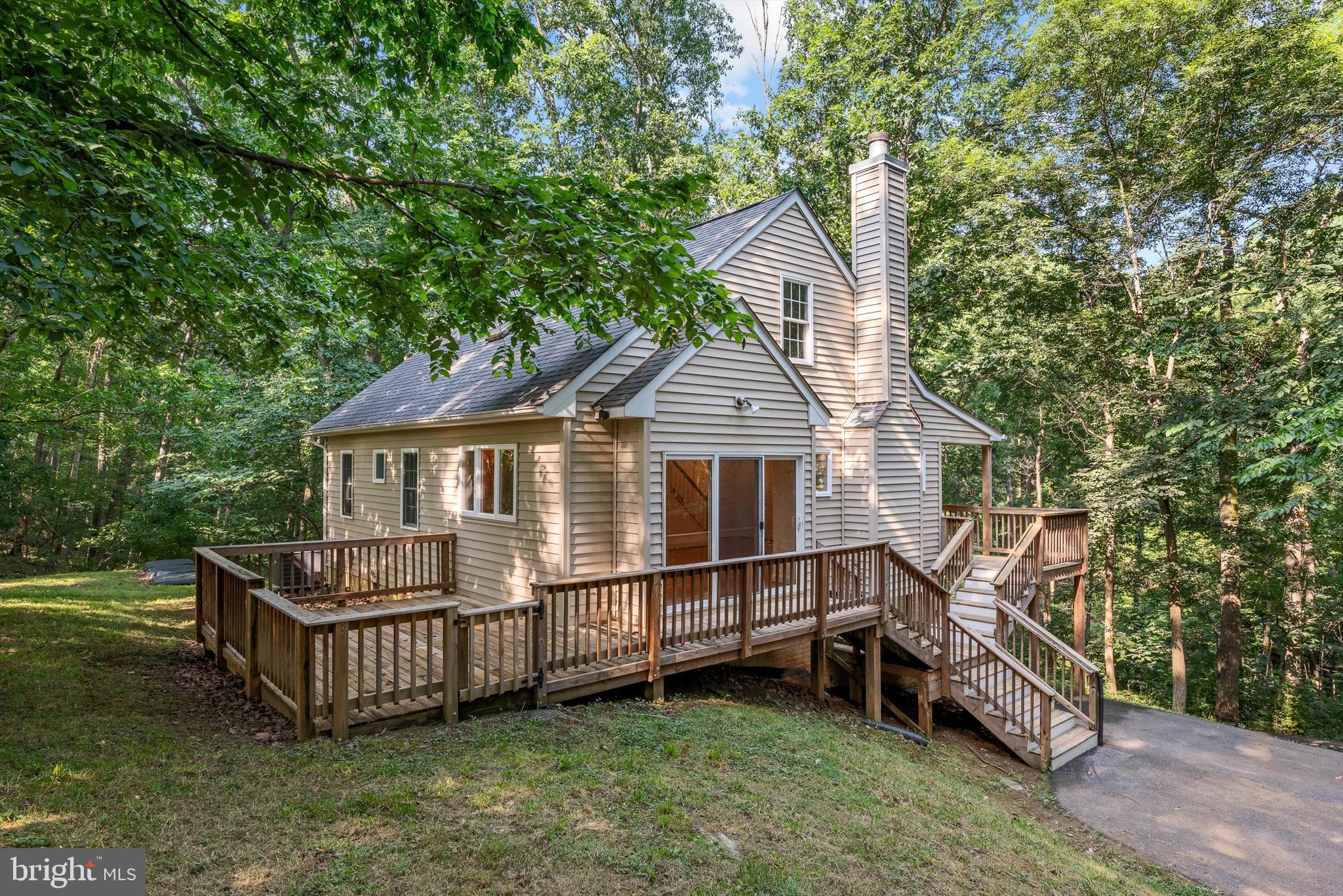 175 Easy Hollow Road Front Royal, VA 22630 - Photo 4 of 42 a view of a house with a yard and deck