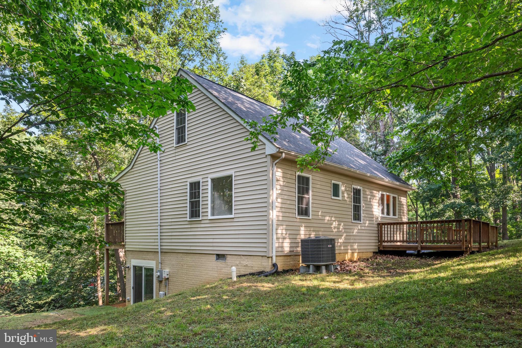 175 Easy Hollow Road Front Royal, VA 22630 - Photo 41 of 42 a view of backyard with a garden and deck