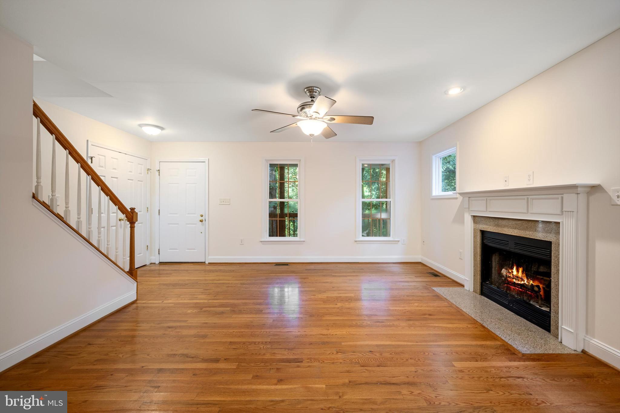 175 Easy Hollow Road Front Royal, VA 22630 - Photo 6 of 42 a view of an empty room with wooden floor fireplace and a window
