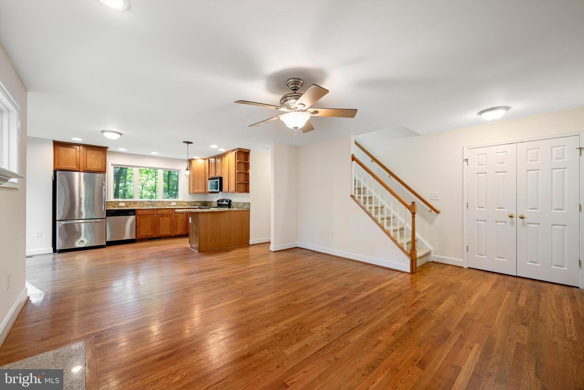 175 Easy Hollow Road Front Royal, VA 22630 - Photo 9 of 42 a view of an empty room with wooden floor a ceiling fan