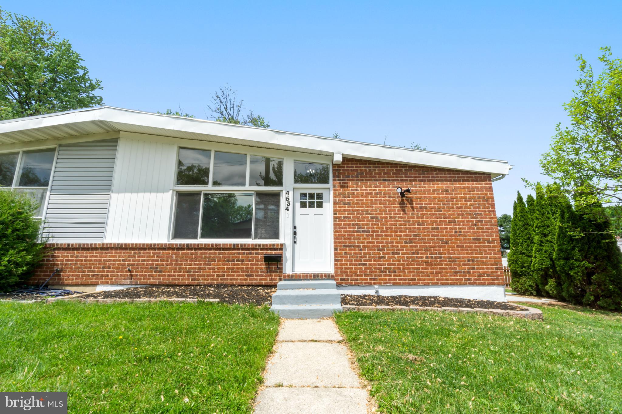 4534 Old Court Road Baltimore, MD 21208 - Photo 1 of 26 a front view of a house with garden