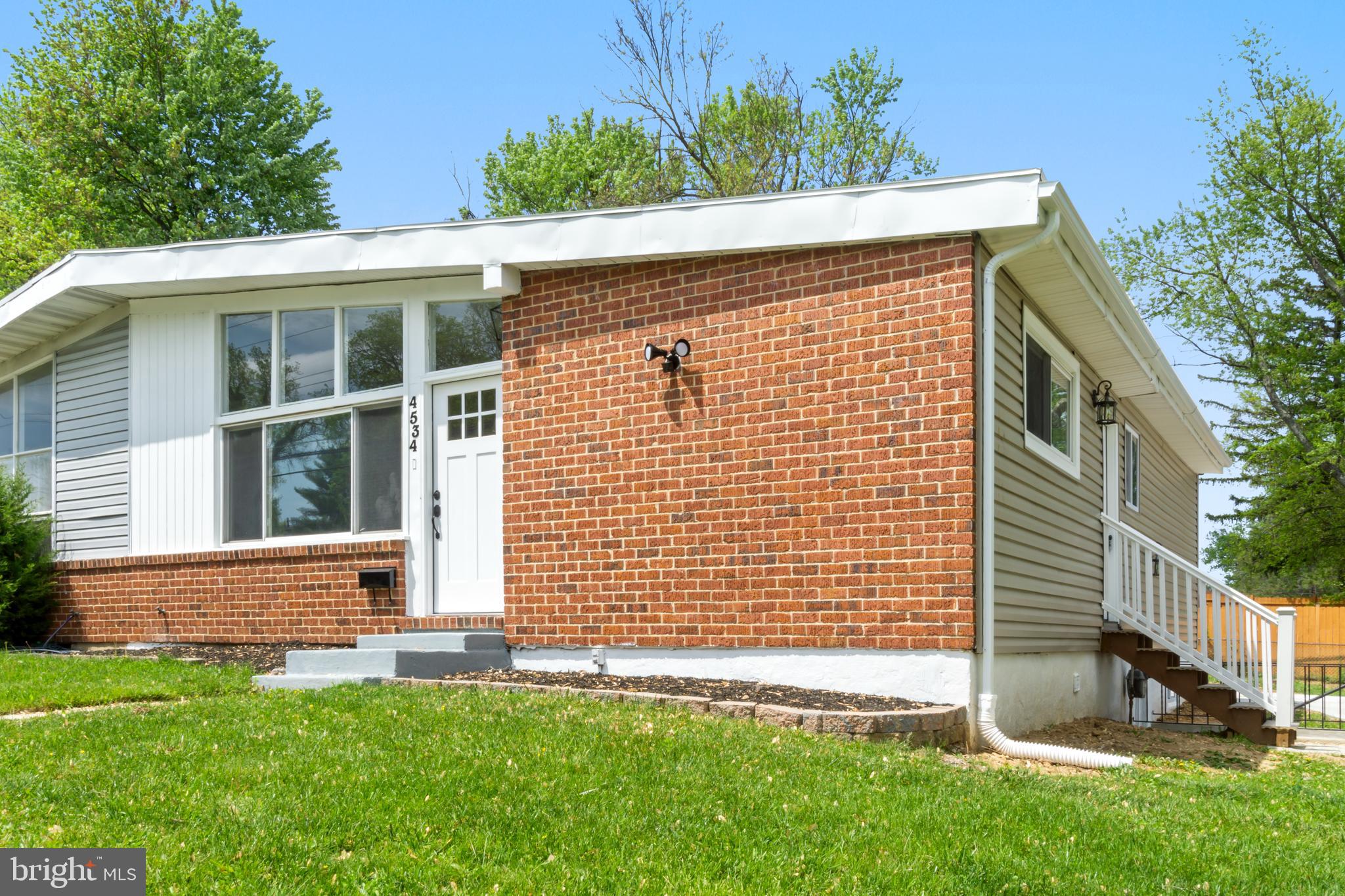4534 Old Court Road Baltimore, MD 21208 - Photo 2 of 26 a front view of a house with a yard