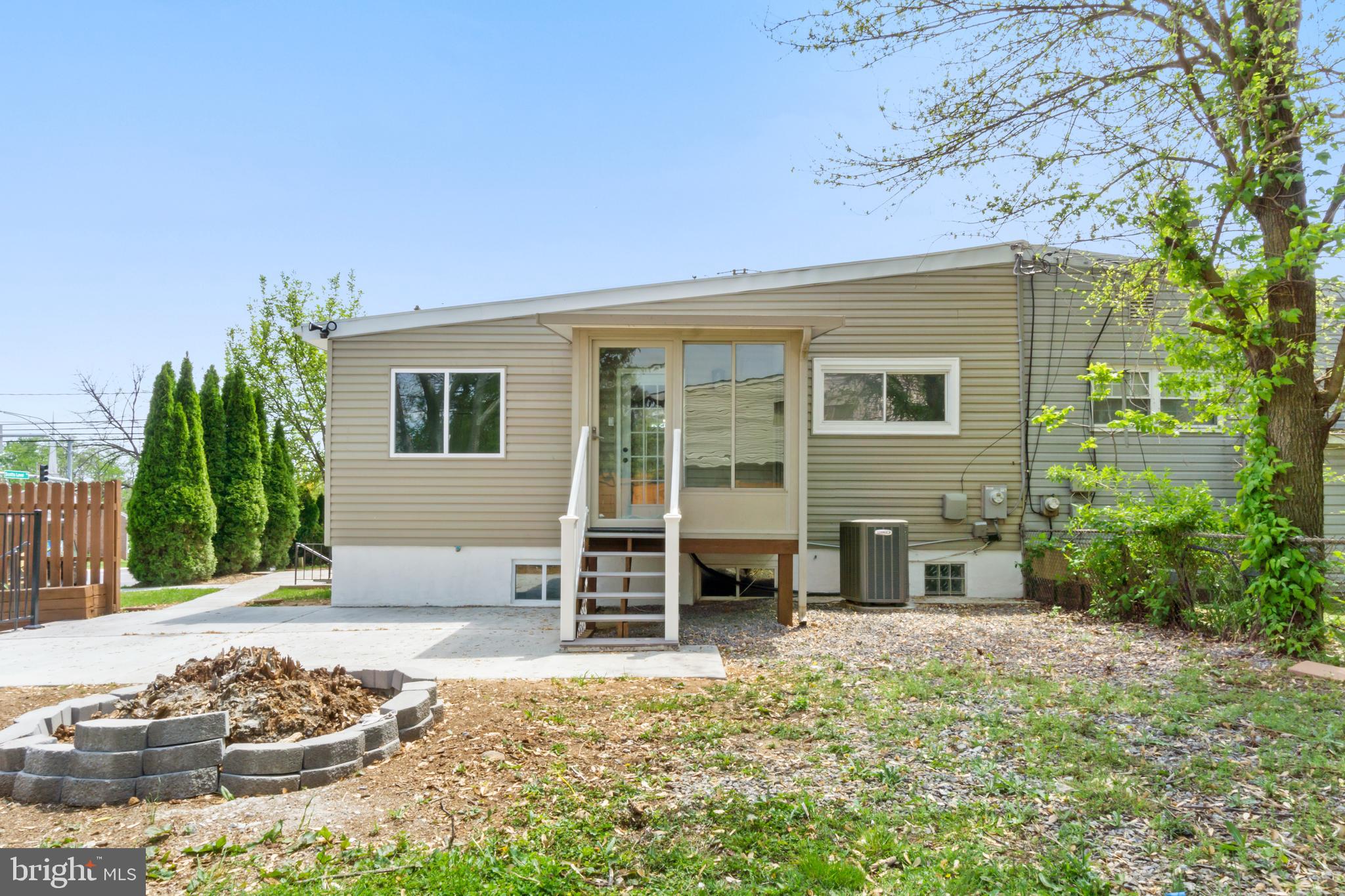 4534 Old Court Road Baltimore, MD 21208 - Photo 24 of 26 a front view of a house with a yard