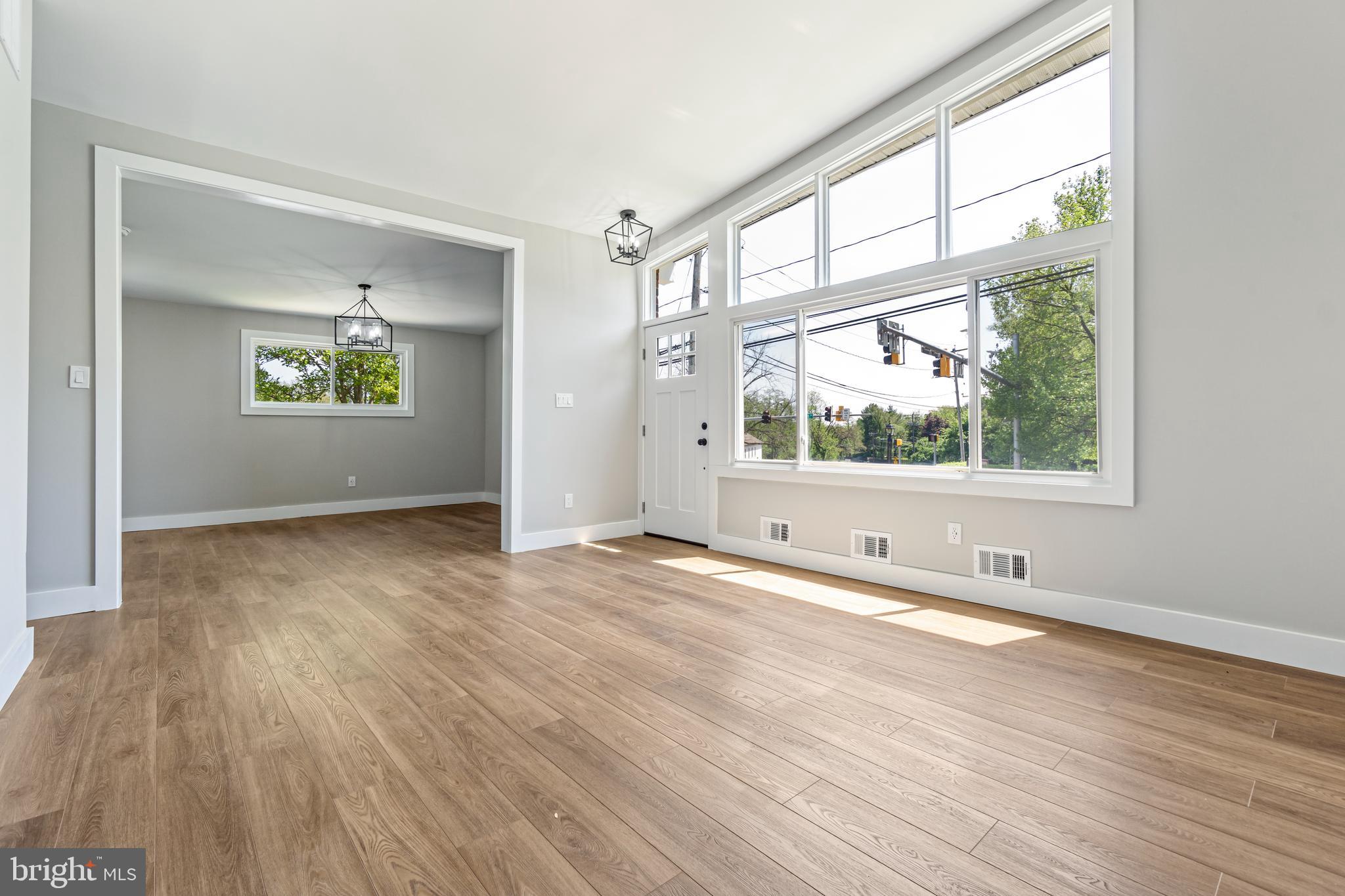 4534 Old Court Road Baltimore, MD 21208 - Photo 4 of 26 an empty room with wooden floor and windows