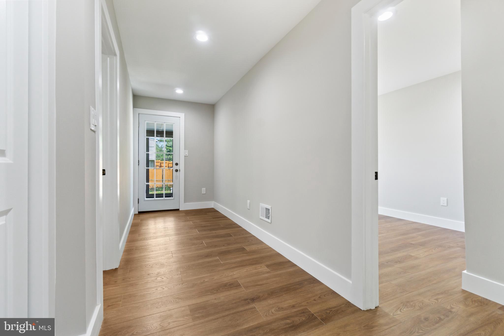 4534 Old Court Road Baltimore, MD 21208 - Photo 9 of 26 a view of an empty room with wooden floor