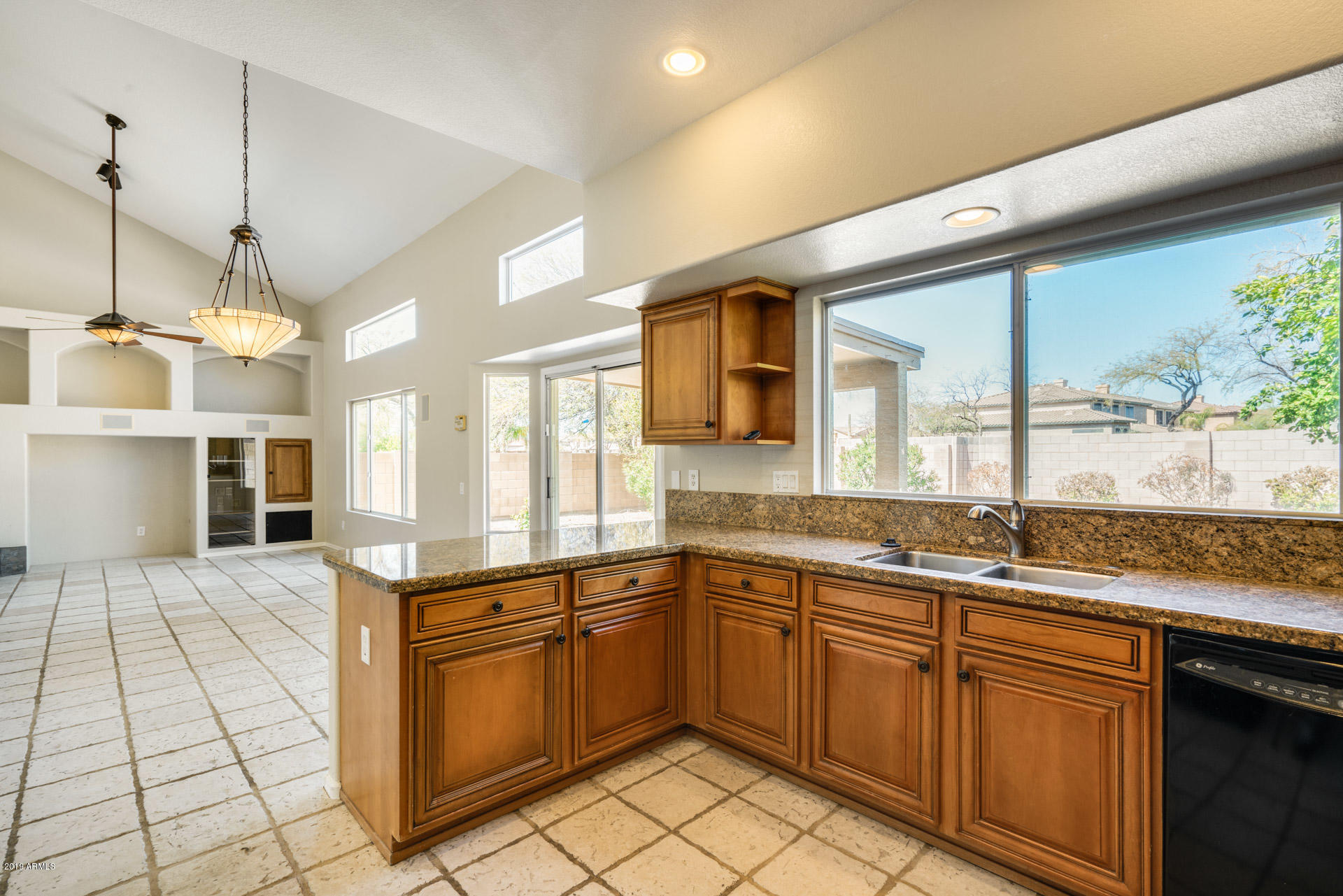 4522 East Rowel Road Phoenix, AZ 85050 - Photo 15 of 37 a kitchen with a sink stove and cabinets