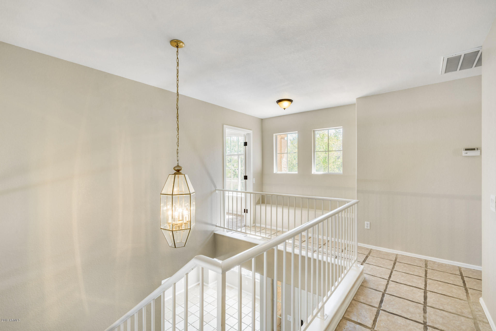 4522 East Rowel Road Phoenix, AZ 85050 - Photo 21 of 37 a view of a hallway with windows