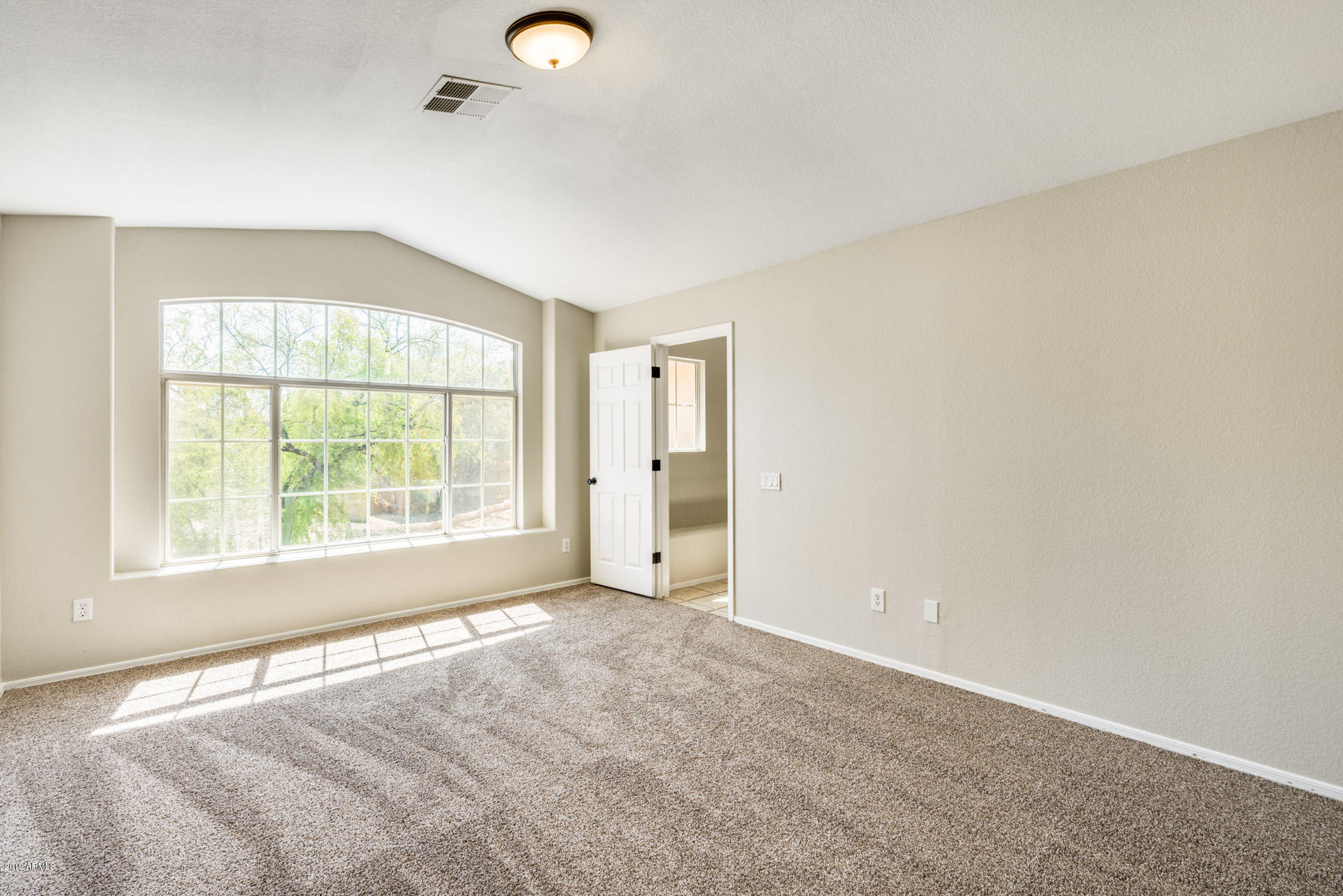 4522 East Rowel Road Phoenix, AZ 85050 - Photo 23 of 37 an empty room with windows