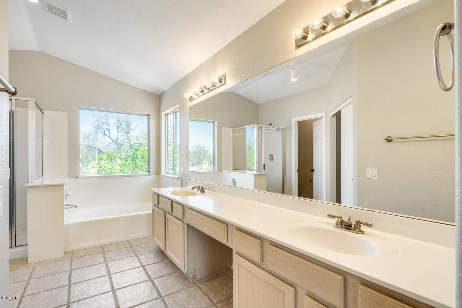 4522 East Rowel Road Phoenix, AZ 85050 - Photo 24 of 37 a bathroom with a tub sink and mirror