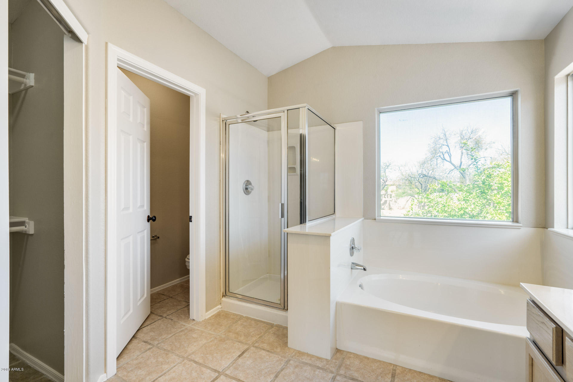 4522 East Rowel Road Phoenix, AZ 85050 - Photo 25 of 37 a bathroom with a bathtub and a shower
