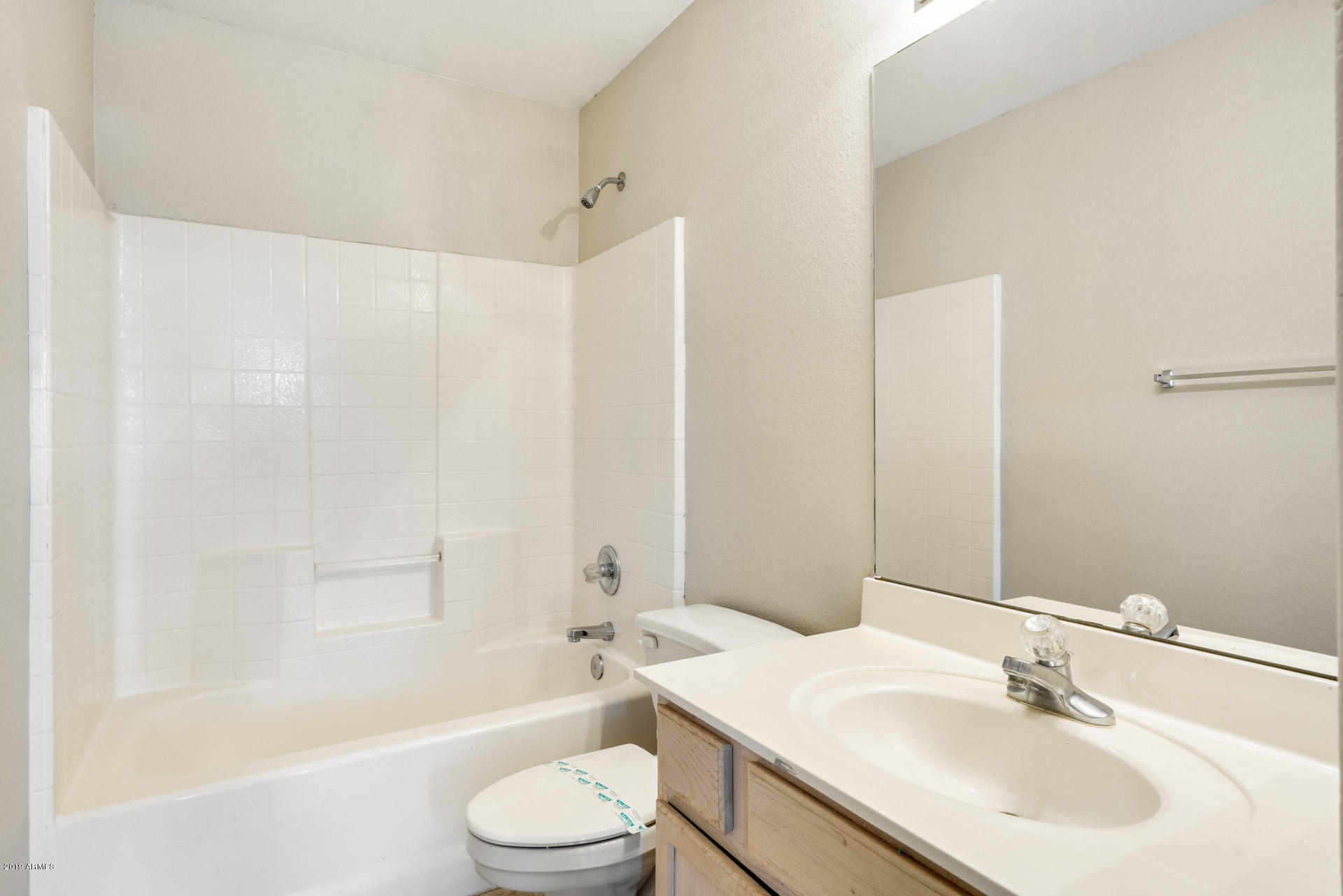 4522 East Rowel Road Phoenix, AZ 85050 - Photo 27 of 37 a bathroom with a sink a toilet and shower