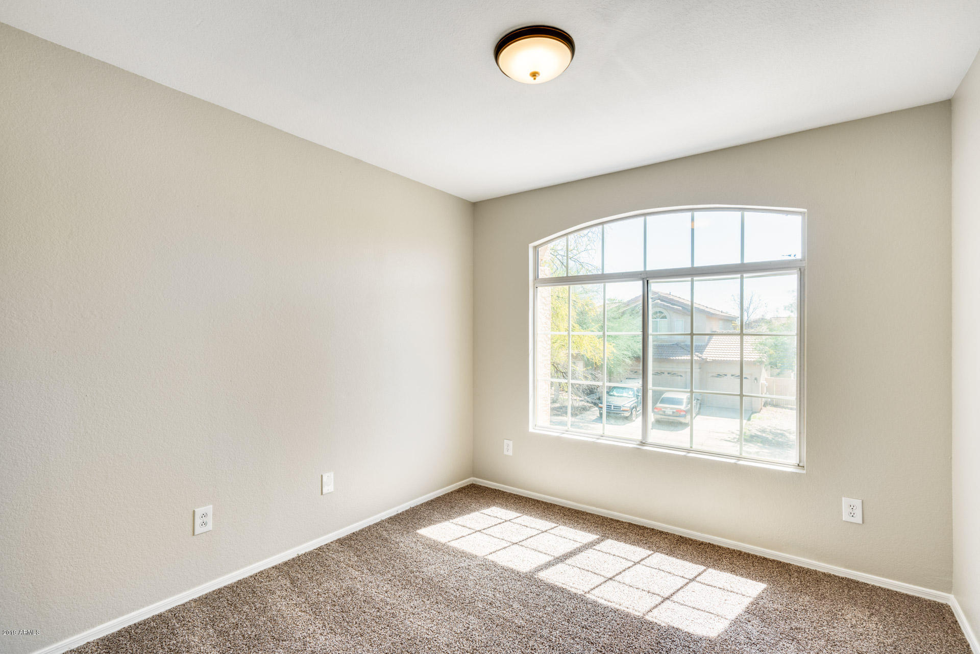 4522 East Rowel Road Phoenix, AZ 85050 - Photo 28 of 37 an empty room with windows