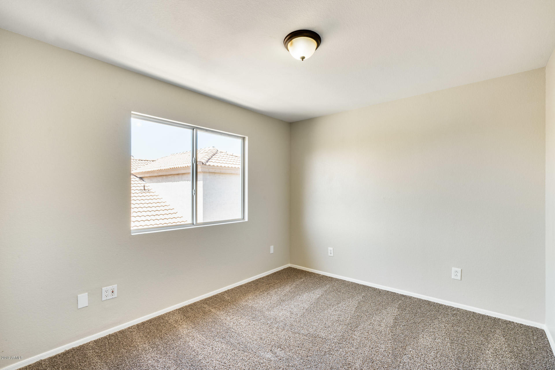 4522 East Rowel Road Phoenix, AZ 85050 - Photo 31 of 37 an empty room with a window