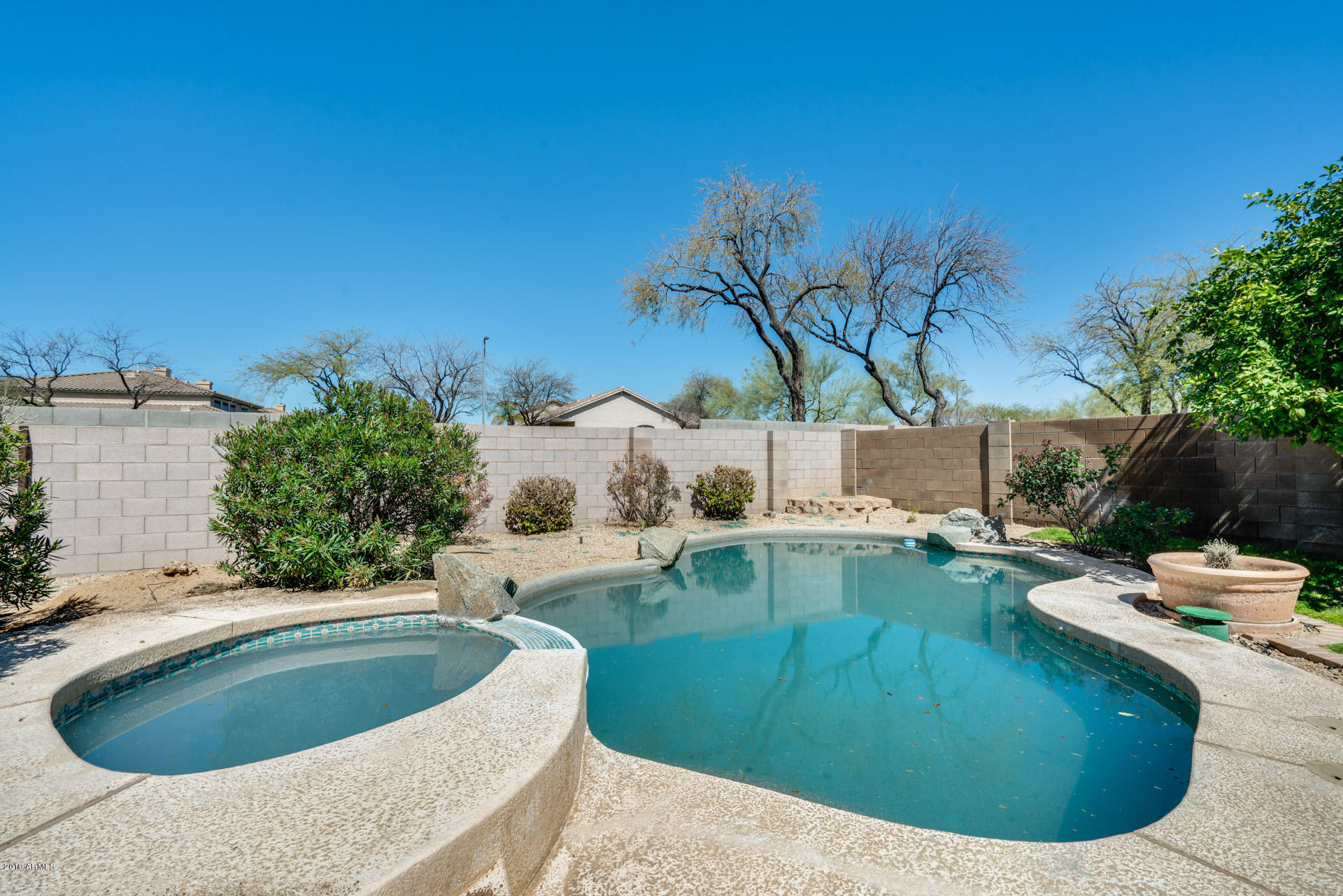 4522 East Rowel Road Phoenix, AZ 85050 - Photo 35 of 37 a view of a swimming pool with a yard and sitting area