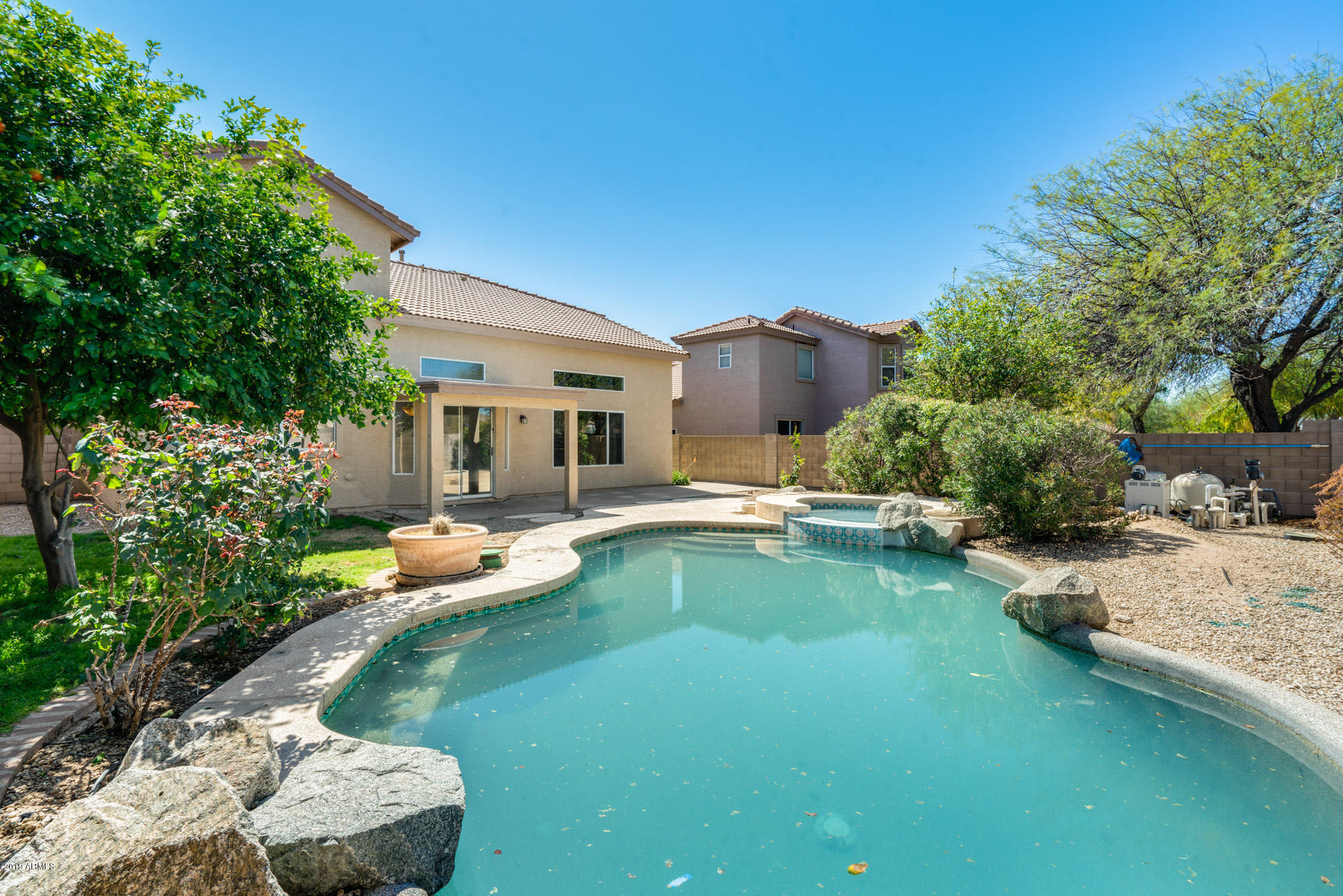 4522 East Rowel Road Phoenix, AZ 85050 - Photo 37 of 37 a view of a house with swimming pool lawn chairs and a yard