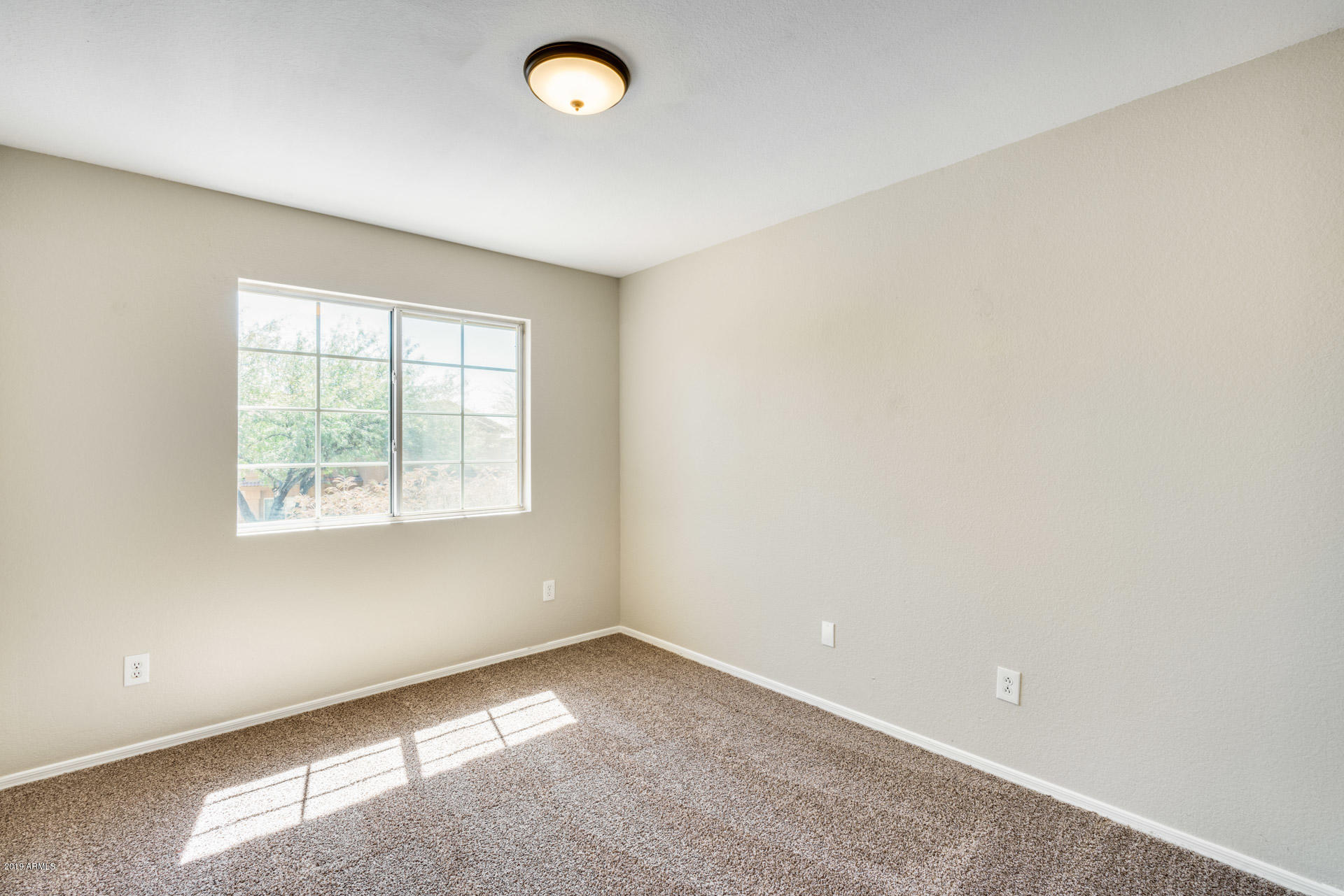4522 East Rowel Road Phoenix, AZ 85050 - Photo 5 of 37 an empty room with a window