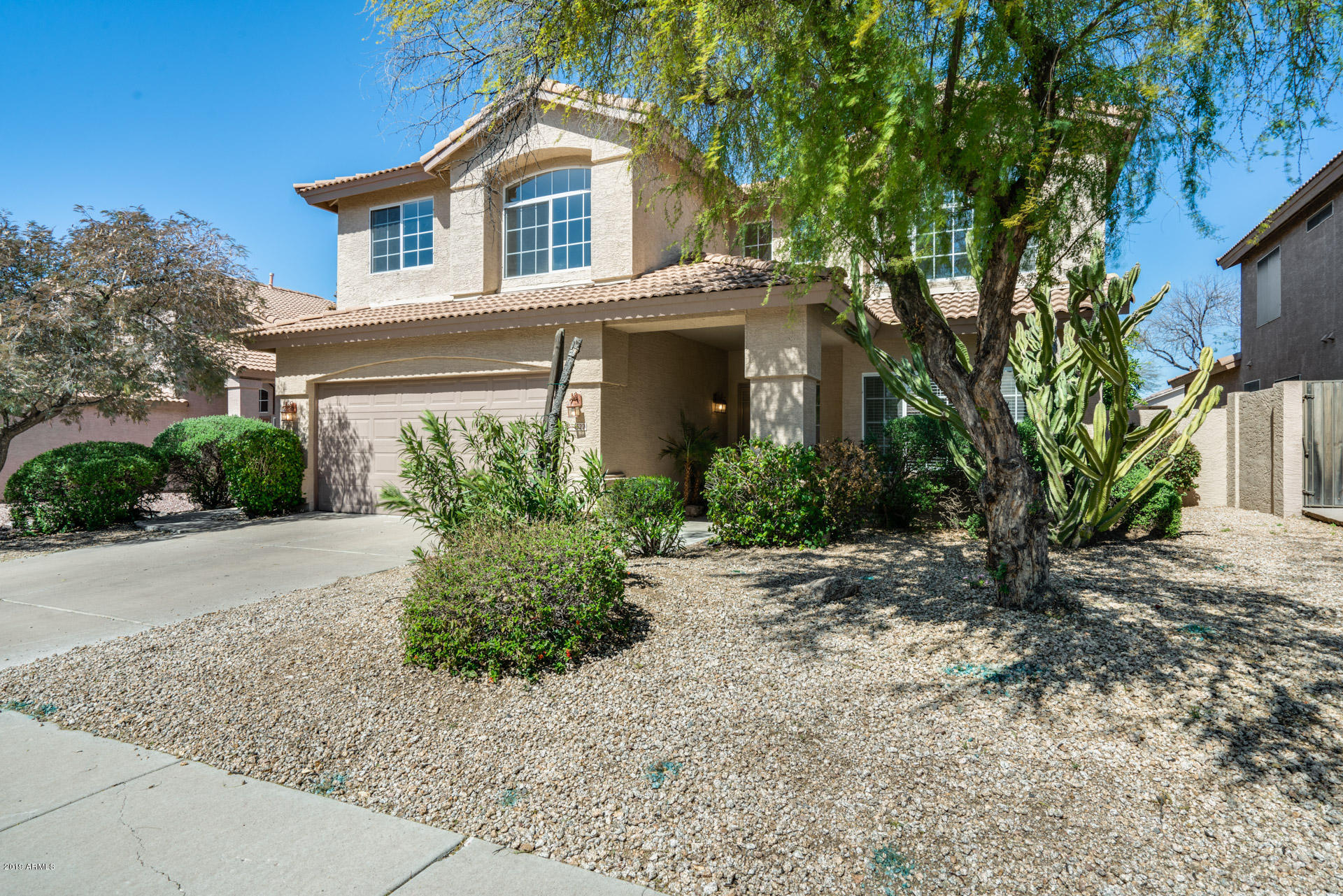 4522 East Rowel Road Phoenix, AZ 85050 - Photo 7 of 37 a front view of a house with a yard and garage