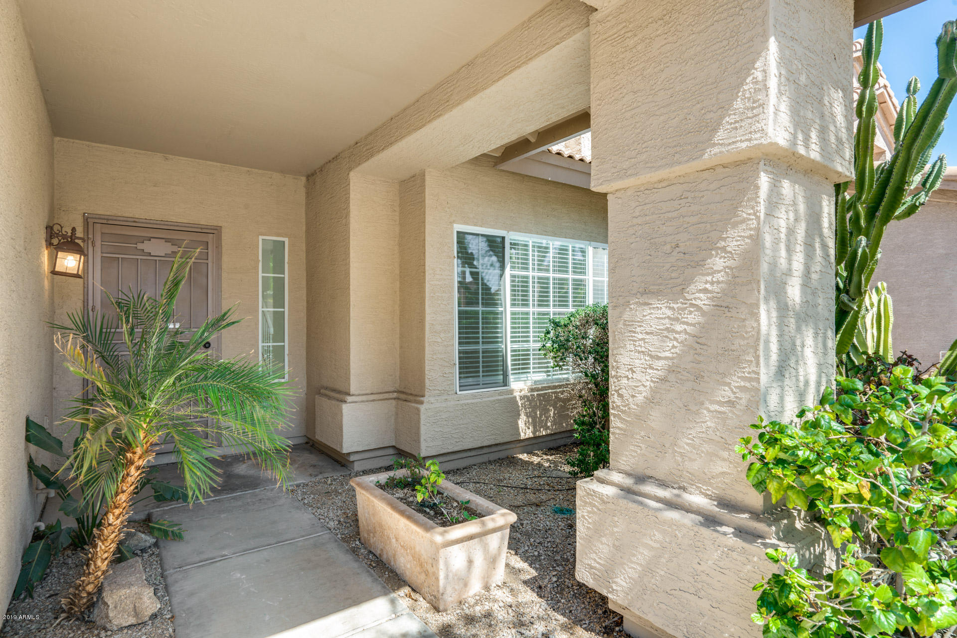 4522 East Rowel Road Phoenix, AZ 85050 - Photo 8 of 37 a front view of a house with garden