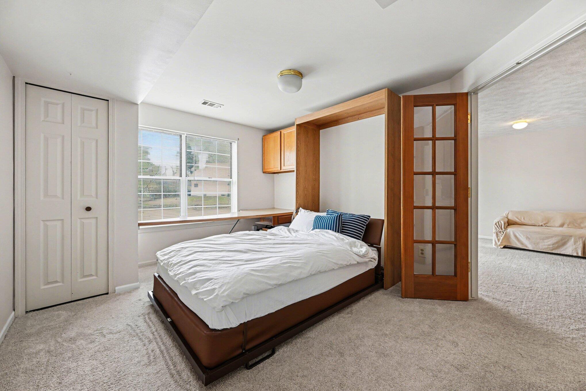 4356 Pine Ridge Court Ann Arbor, MI 48105 - Photo 28 of 35 lower level bedroom w/ murphy bed